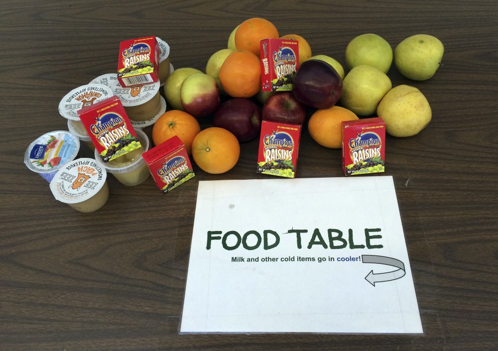 Food share table with apples and milk for students to take.