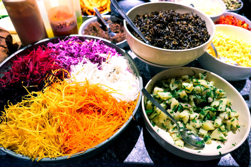 Colorful bowls of shredded vegetables