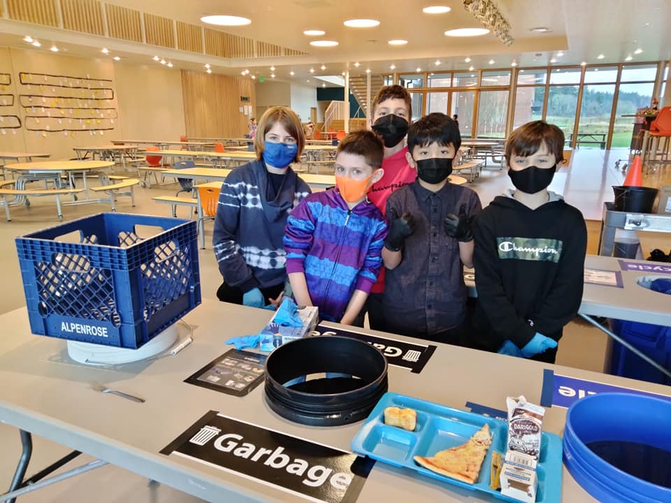Lacamas Lake Elementary Green Team Members pose next to their lunch room sorting table