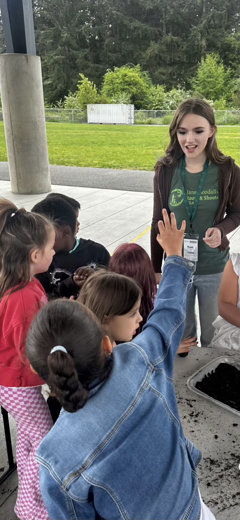 Nateli intereacts with a group of elementary students.